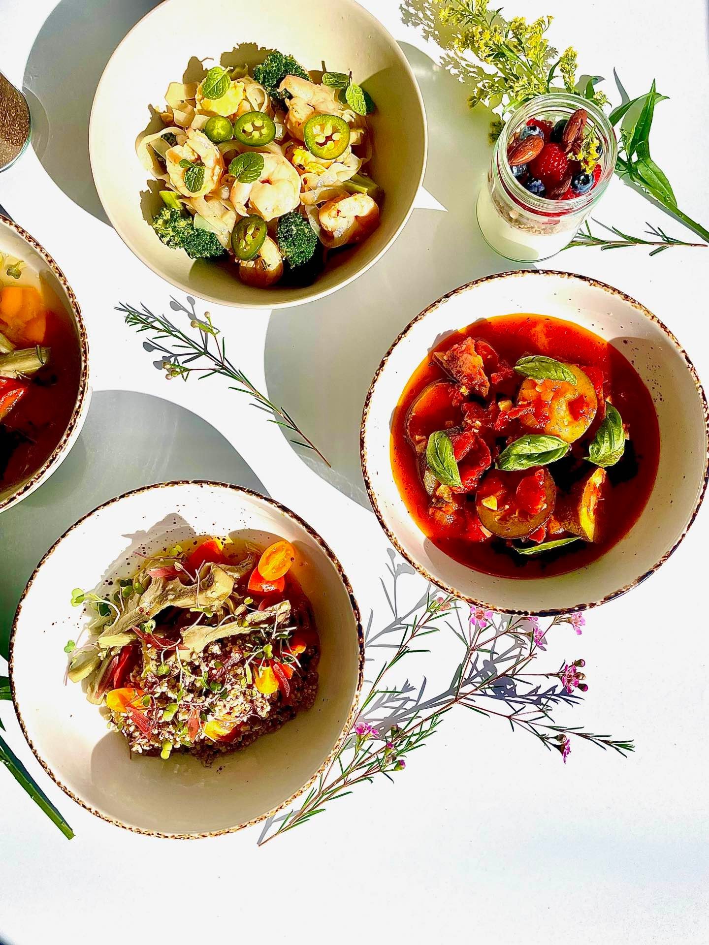 Overhead view of prepared meal portions in bowls